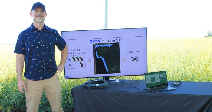 Geco Founder Greg Stewart standing at Geco Strategic Weed Management Booth