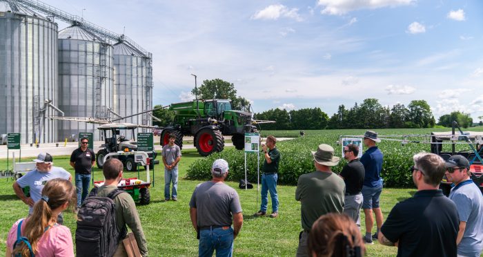 Guests listen to a demonstration at Innovation Farms Ontario x AIVA Network Demo Day.